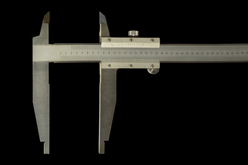Analogue vernier calliper made of stainless steel for precise measurements, isolated on black...