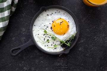 fried eggs in a frying pan