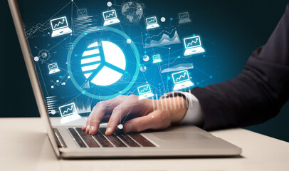 Business hand working on laptop, successful business concept