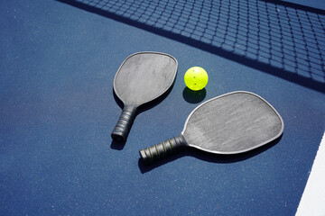 Pickle ball paddle on pickle ball court