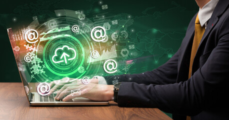 Business hand typing on a modern laptop