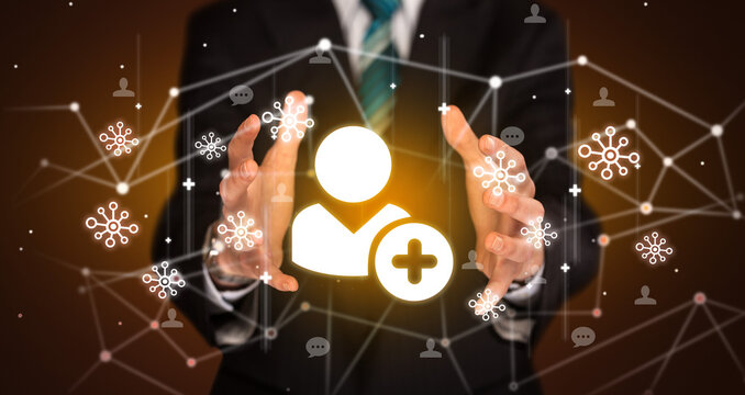 Hand holding social media icons