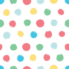 Simple seamless background in polka dots. Hand drawn.