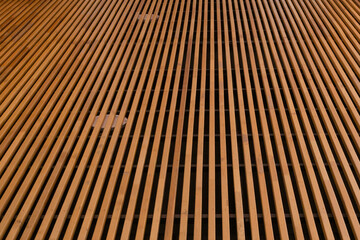 Fototapeta premium Installation of wooden moldings on the ceiling of a building or house's first floor parking lot