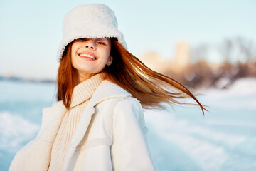 pretty woman in a white coat in a hat winter landscape walk travel