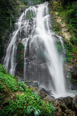 Fototapeta na wymiar Amazing waterfall in green forest,The terrestrial Halaza Waterfall is in Bang Lang National Park Tham Thalu , Bannang Sata , Yala Thailand