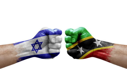 Two hands punch to each others on white background. Country flags painted fists, conflict crisis concept between israel and saint kitts and nevis