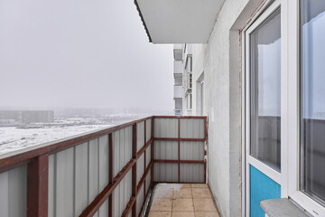 A photo of a balcony in winter 