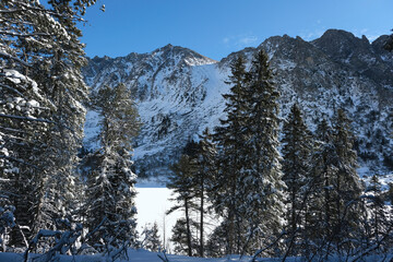 Beautiful snowy scenery with mountains in High Tatras near to Poprad Lake, Slovakia