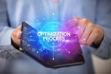 Businessman holding a foldable smartphone, new business concept