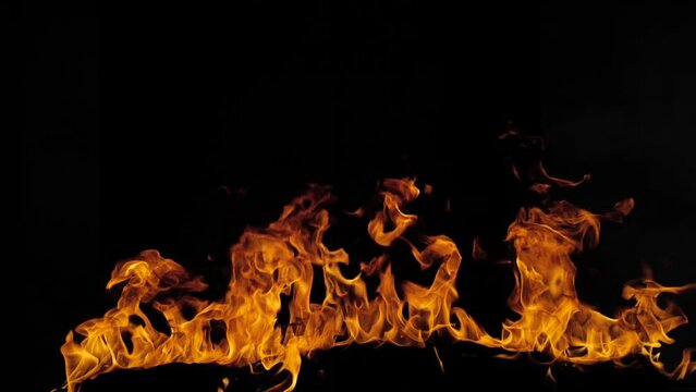 Fire slow motion on a black background. Abstract fire flame background, large burning fire.