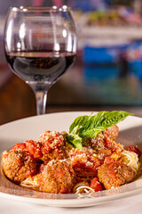 Spaghetti and meatballs with red wine