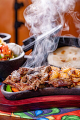 Steak and Shrimp Fajitas with sides