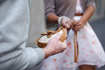 Give it back. Closeup cropped image of a woman having her bag snatched by a criminal.