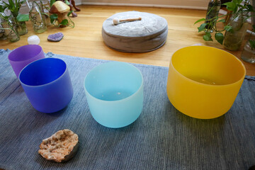 Yoga rug with colored crystal sound bowls meditation concept