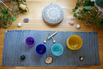 Yoga rug with colored crystal sound bowls meditation concept