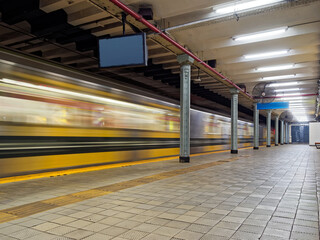 Subway train entering empty station - 489616259