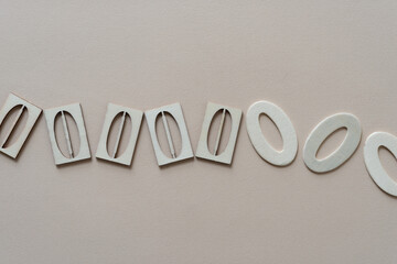 wooden zeros on paper