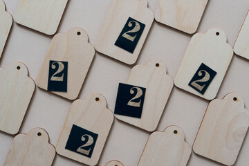 the number 2 on wooden tags