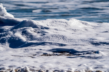 Fototapeta na wymiar Sea Foam From Broken Waves