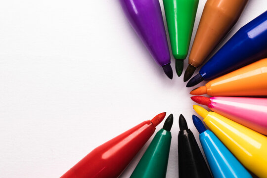 Beautiful image of group of coloring pen marker create semi circle at the center with the white background