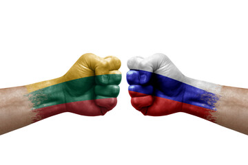 Two hands punch to each others on white background. Country flags painted fists, conflict crisis concept between lithuania and russia