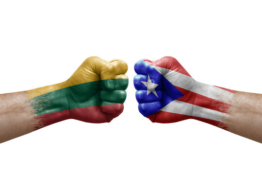 Two hands punch to each others on white background. Country flags painted fists, conflict crisis concept between lithuania and puerto rico