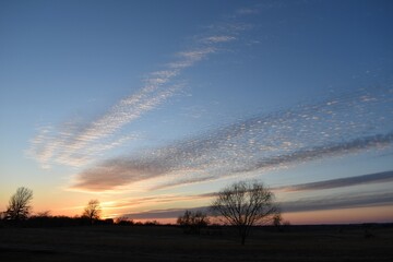 Sunset Over a Rural Farm Field
