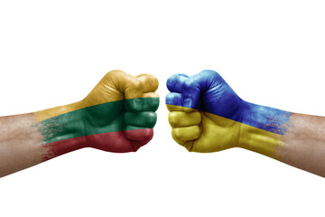 Two hands punch to each others on white background. Country flags painted fists, conflict crisis concept between lithuania and ukraine