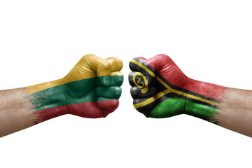 Two hands punch to each others on white background. Country flags painted fists, conflict crisis concept between lithuania and vanuatu