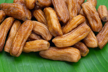 Sun-dried bananas on banana leaf