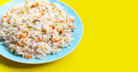 Crab fried rice inblue plate on yellow background
