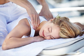 Obraz na płótnie Canvas Enjoying a great massage. Young woman receiving a relaxing massage.