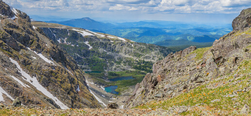 View from the pass to the mountain gorge with lakes, summer travel