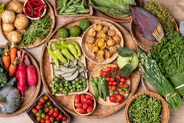 Organic Southeast Asian vegetables, edible flowers and fruits from local farmers market, Northern of Thailand, Sustainability concept, Top view