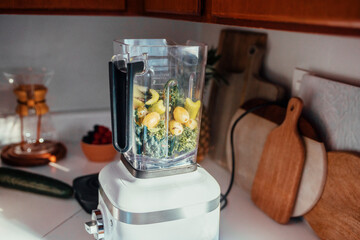 A woman makes a health food smoothie