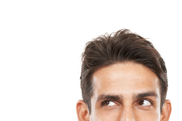 Inquisitive about your copyspace. Cropped shot of a young mans face looking sideways towards copyspace.