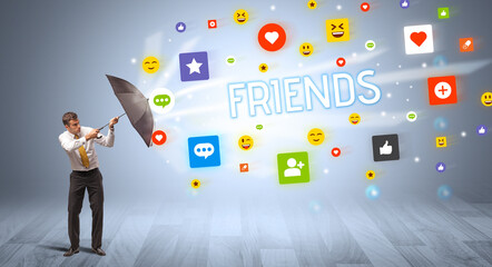 businessman defending with umbrella from social media