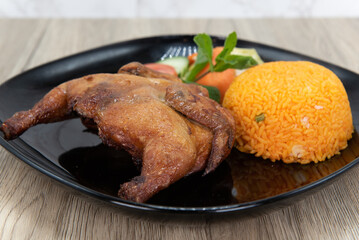 Crispy rotisserie chicken served with rice for a delicious Vietnamese meal