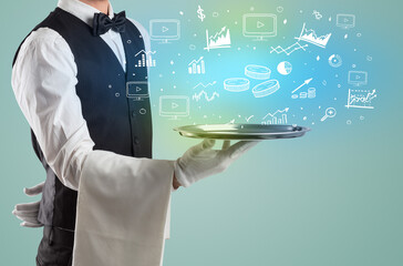 Handsome young waiter in tuxedo holding money icons on tray
