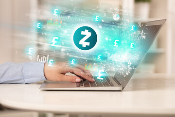 Young man watching stock market on laptop