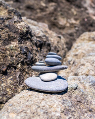 Fototapeta na wymiar Rock cairn found on a rocky coastline