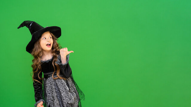 The child is ready for the heluin holiday. A girl in a witch's magic hat.