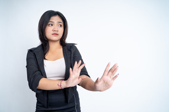 asian woman refusing with both palms gesture side a copyspace
