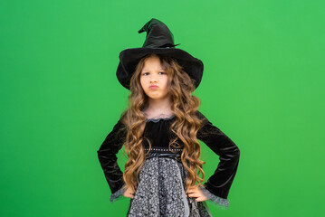 An offended little witch on an isolated background.