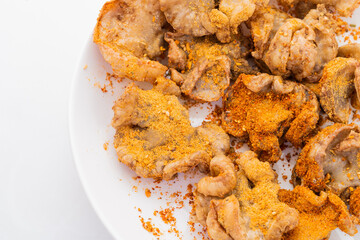 Fresh fried chicken comb oil on white background
