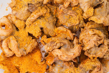 Fresh fried chicken comb oil on white background