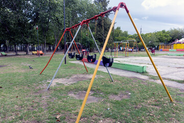 Empty playground swings in Buenos Aires (Argentina)