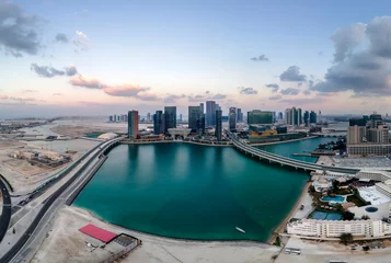 Schilderijen op glas Aerial view on Al Reem island in Abu Dhabi at sunset © Freelancer