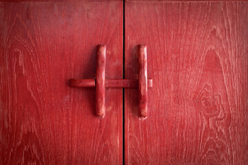 closeup old ancient red wooden door lock or traditional retro blood wood double doors and window closed or cabinet locker for background and frame isolated with clipping path on black door groove